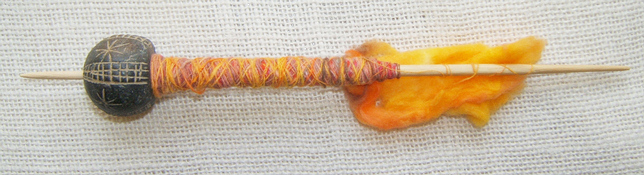 Old Mali spindle whorl bead made into a working support spindle